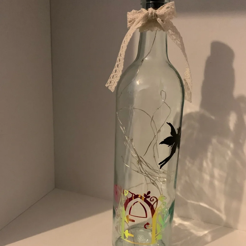 Fairy door lighted wine bottle
